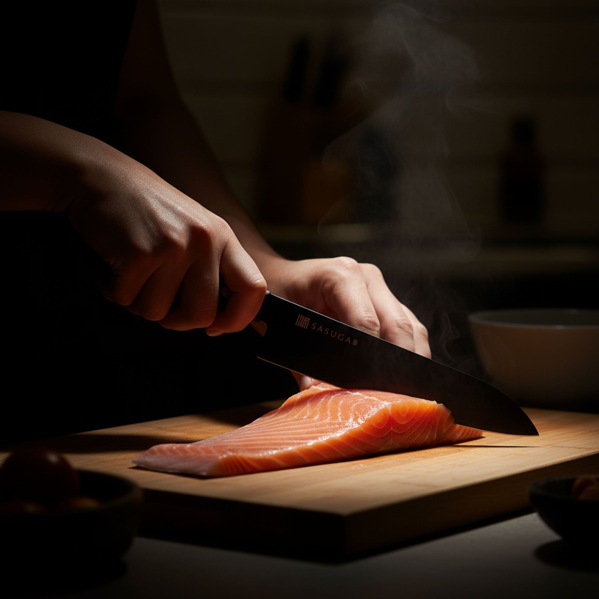 Person cutting salmon on a wooden board with a knife in a dimly lit kitchen.