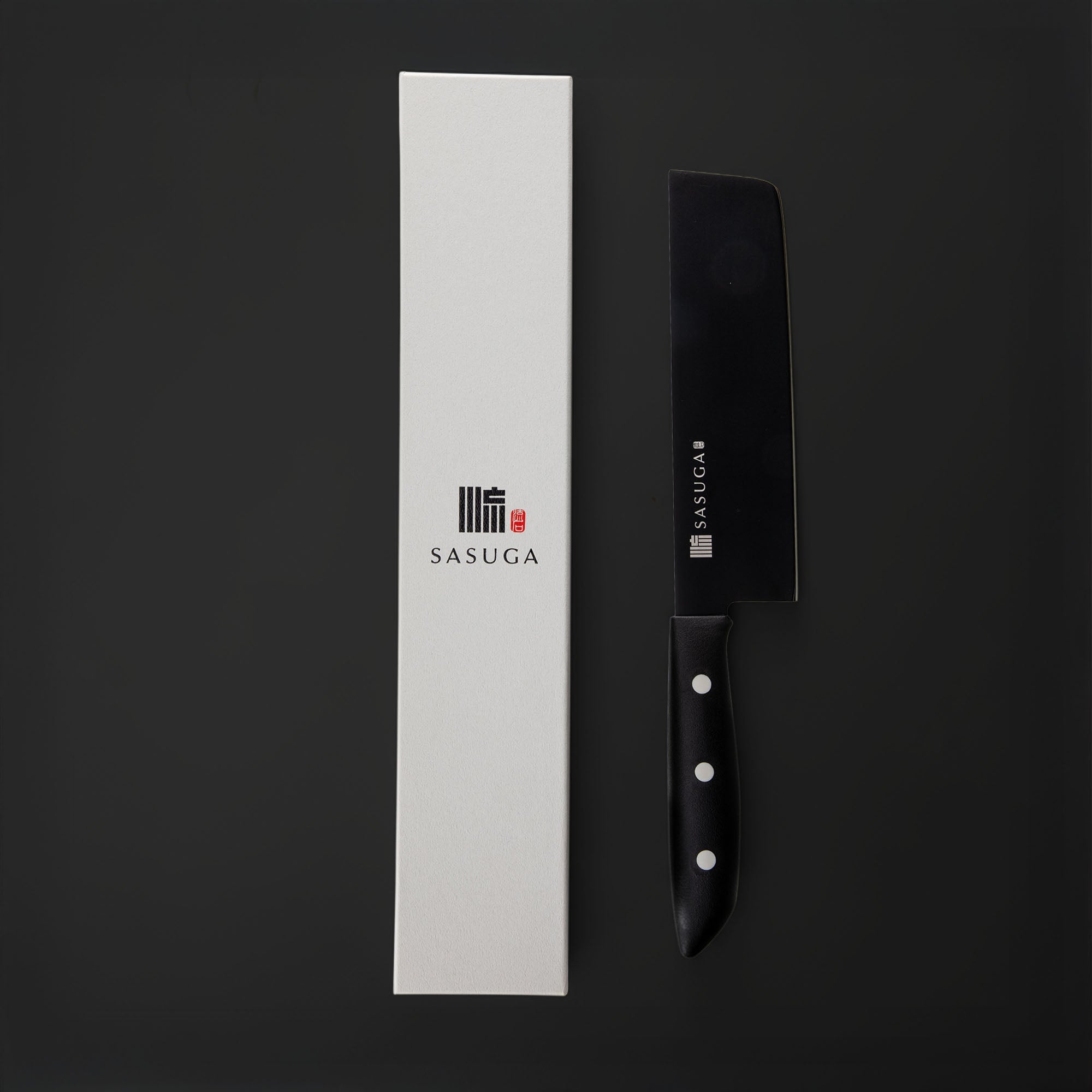 Black kitchen knife with black handle and white blade on a black background, next to a white box with 'SASUGA' branding.