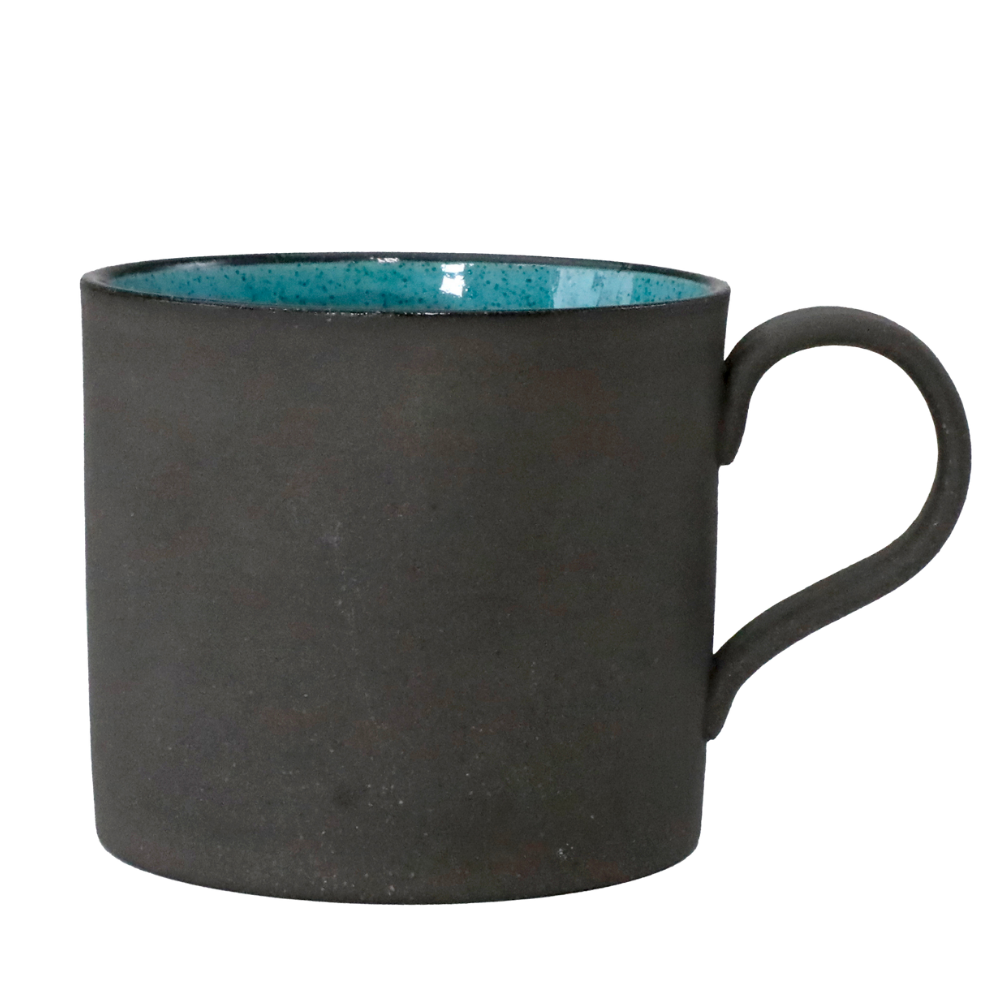 Handmade Mino-yaki ceramic mug with matte black clay exterior and deep blue glaze, made in Japan