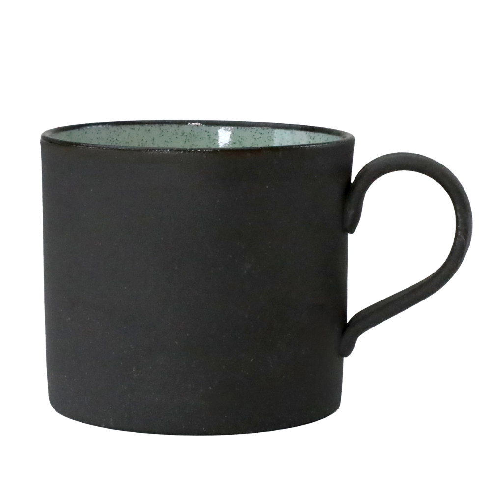 Handmade Mino-yaki ceramic mug with matte black Kurotsuchi exterior and Peridot green glaze, made in Japan