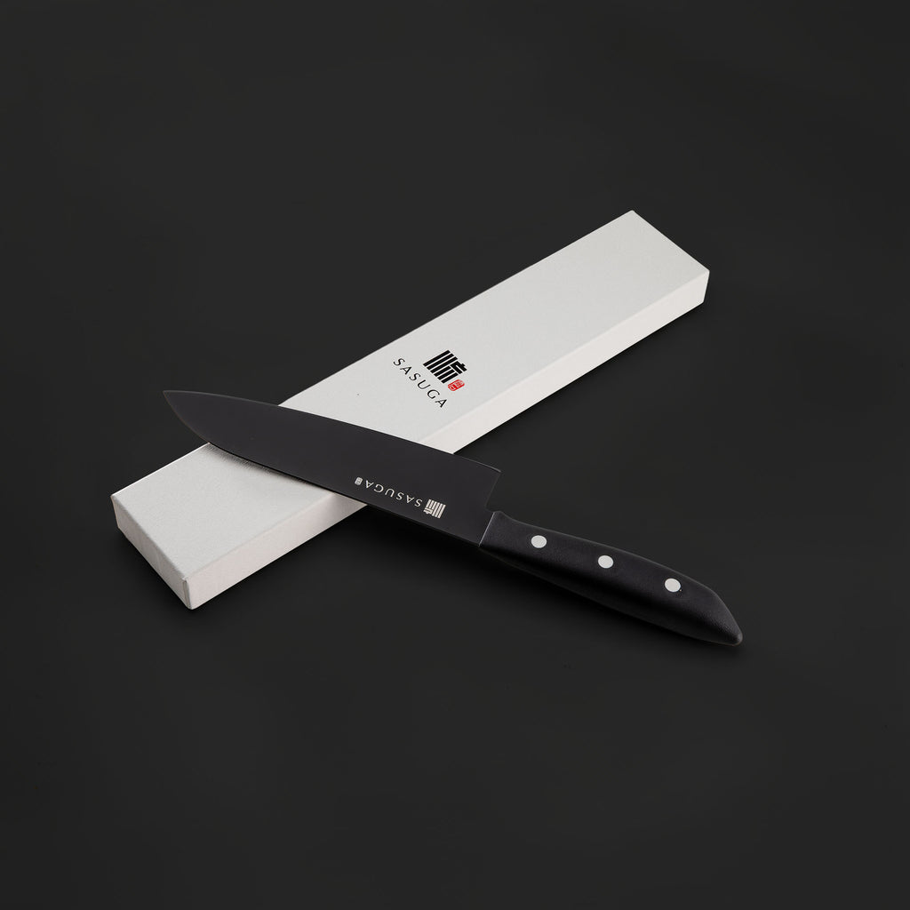 Black knife with a sharpener and 'Sasuga' branding on a dark background