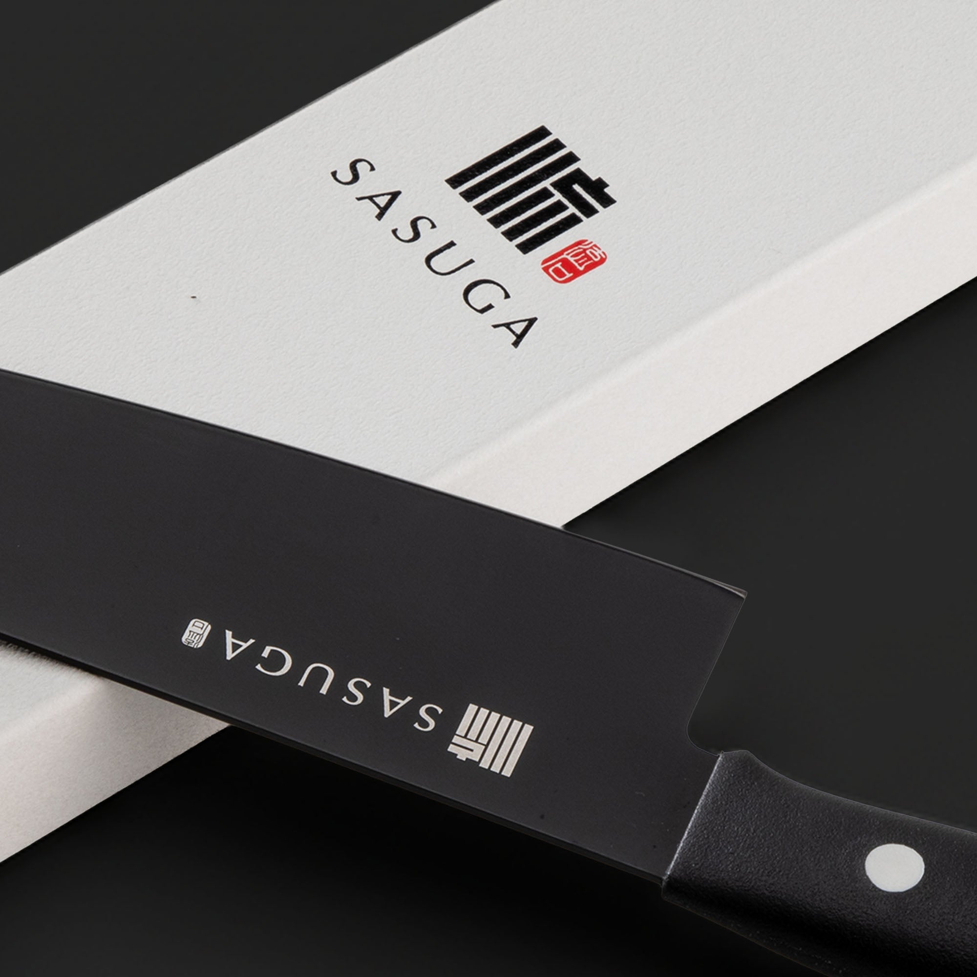 SASUGA branded knife with a black blade and white handle on a dark background