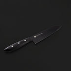 Black kitchen knife with a visible brand logo on a dark background
