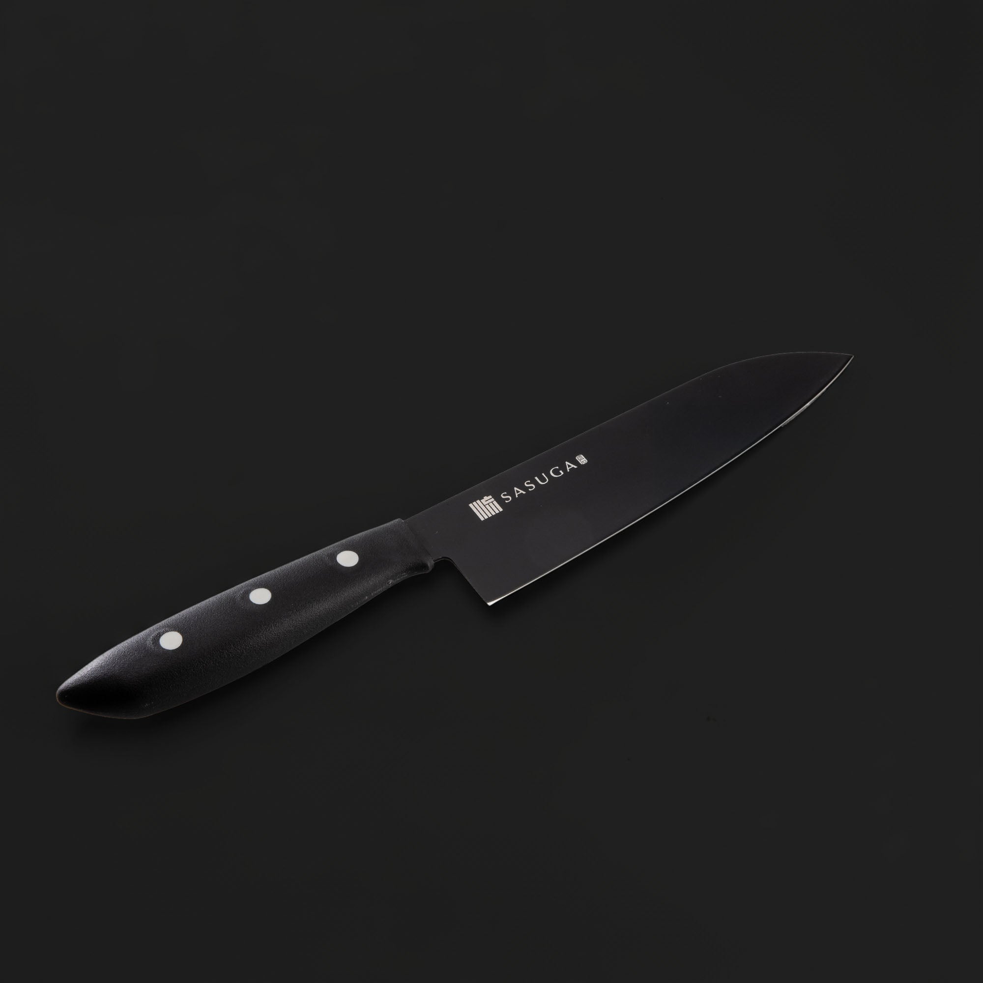 Black kitchen knife with a visible brand logo on a dark background