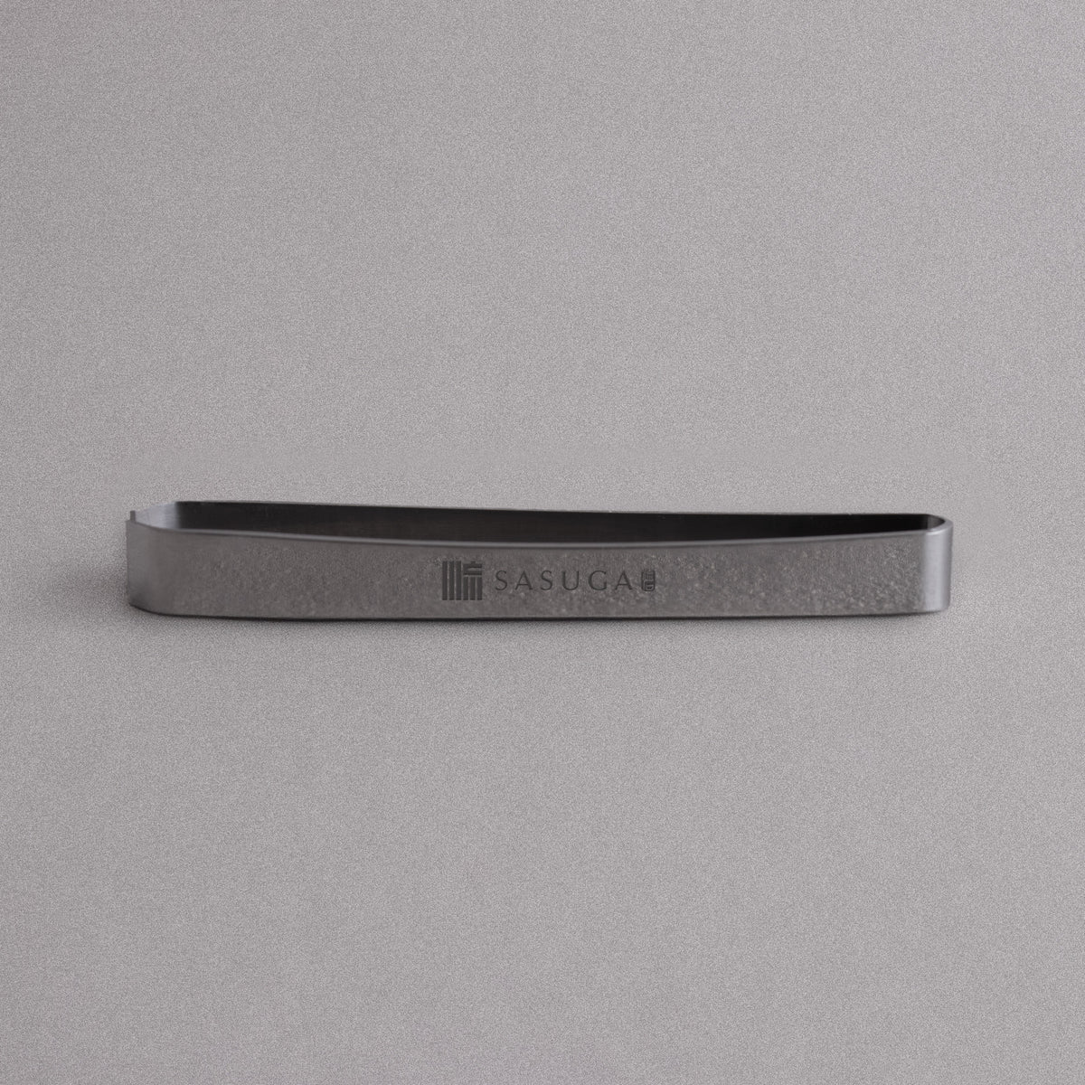 SASUGA fish bone tweezers with engraved logo on a gray background